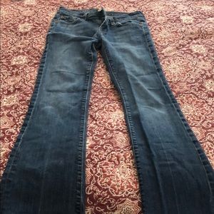 7 For All Man Kind medium blue boot cut jeans.